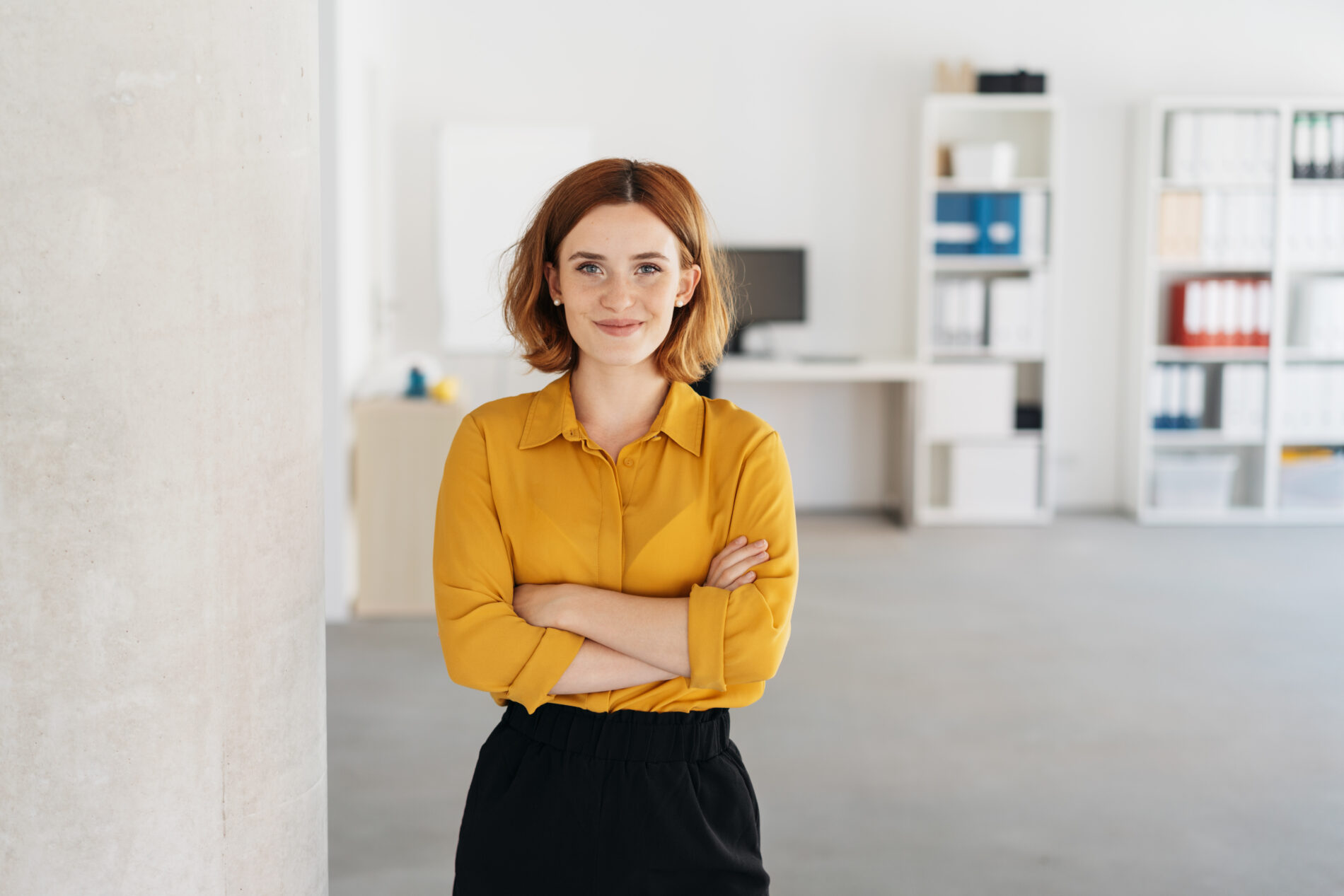 Happy relaxed confident young businesswoman