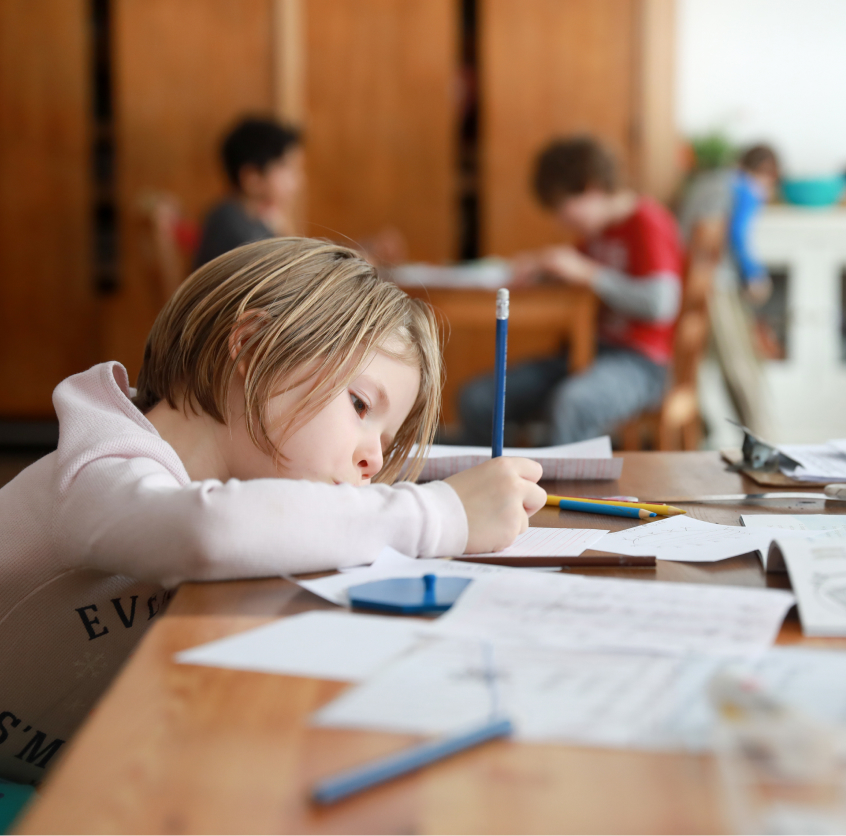 Student focused and working at desk