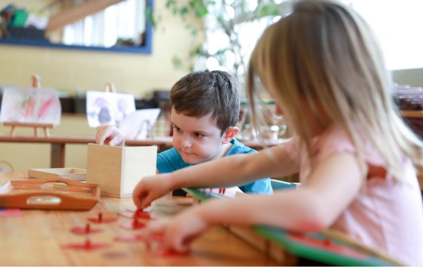 Two students working on puzzles