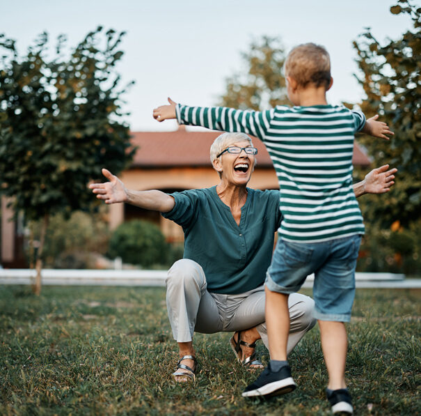 Woman happily greeting child
